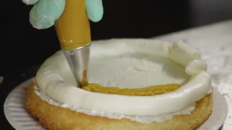 Close-up, Pastry Puts Fruit Jam on Biscuit Cake at Restaurant Kitchen Stock Footage 141082407