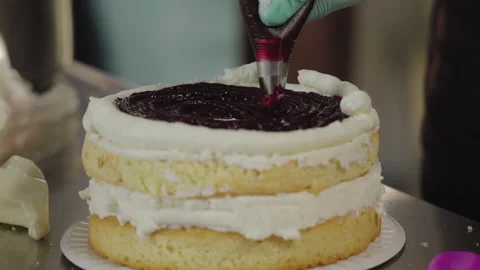 Close-up, Pastry Squeezes Fruit Jam Top on Biscuit Cake Stock Footage 140490954