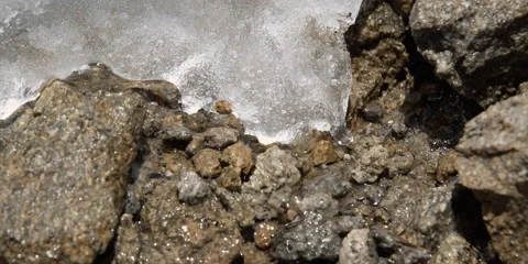 Close-up patch of melting ice on rocks 스톡 동영상 59105122