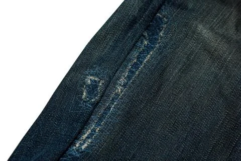 Close up of a patch on a pair of ripped jeans 스톡 사진