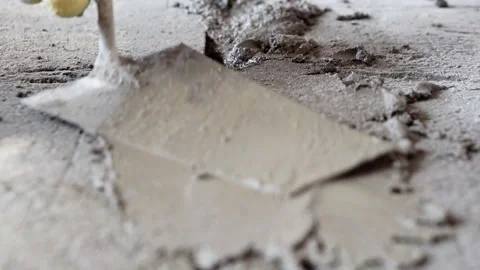 A close-up of patching the hole with concrete. Stock Footage 242192234