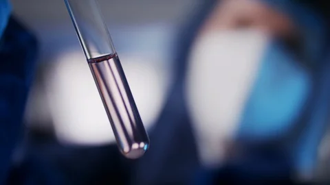 Close up, Pathology testing laboratory, scientist analyzing liquid in the glass Video stock 128842202