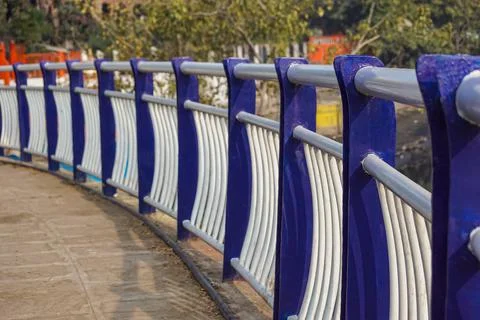 Close-Up of a pathway railing with selective focus and blurred effect. Stock Photos