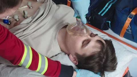 Close-up of a patient being given anesthesia in an ambulance Stock Footage 198839312