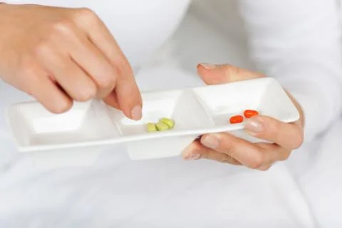Close-up of a patient taking tablets Stock Photos