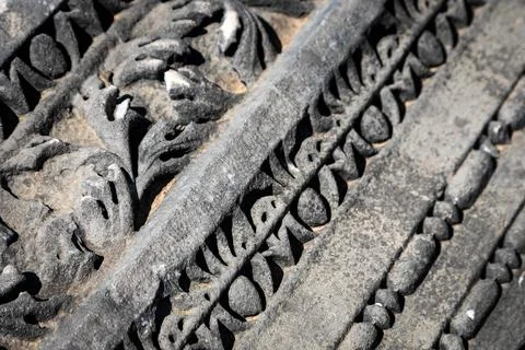 Close-up pattern on antique stone column.Elements of ancient Greek architectu Stock Photos