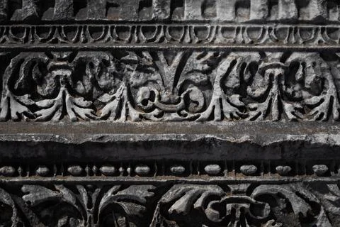 Close-up pattern on antique stone column.Elements of ancient Greek architectu Stock Photos