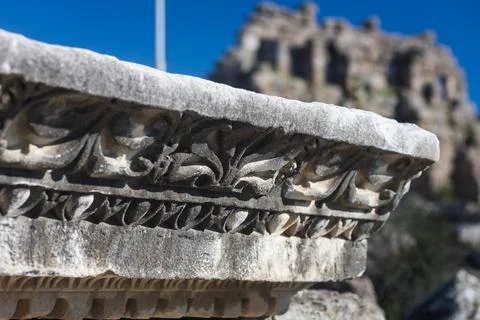 Close-up pattern on antique stone column.Elements of ancient Greek architectu Stock Photos