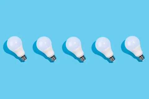 Close up pattern of led lamps on an isolated blue background. Energy efficien Stock Photos