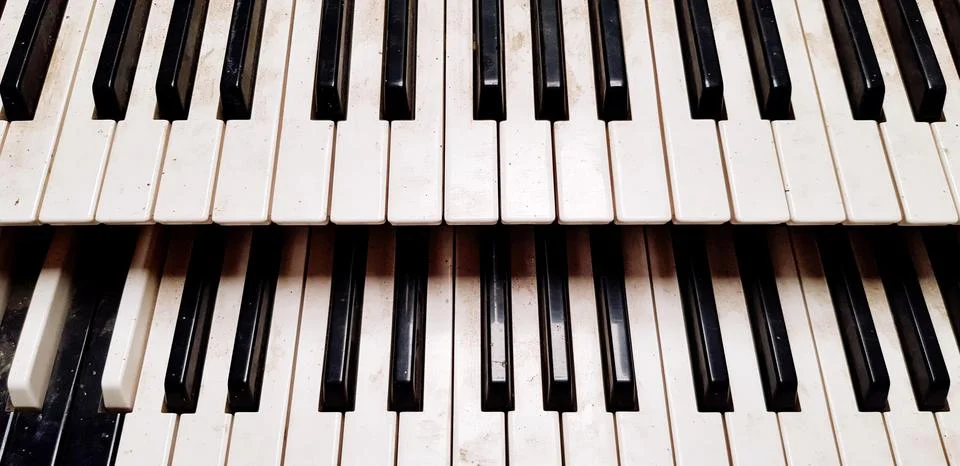 Close up pattern of old or dirty piano keyboard for background. Stock Photos