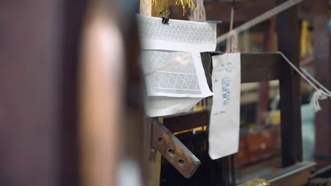 Close up of pattern scheme on foot-treadle loom machine Stock Footage 79144219