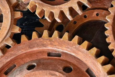 Close up pattern of sculpture using old rusted gears Stock Photos