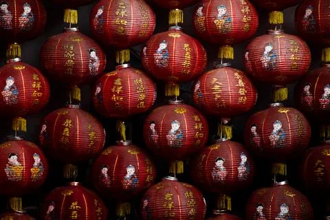 Close Up Pattern Of Traditional Red Chinese Lanterns With Gold Calligraphy. Stock Photos