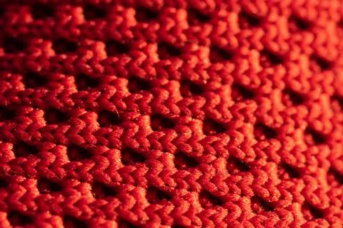 A close-up pattern of a woven red fabric Stock Photos