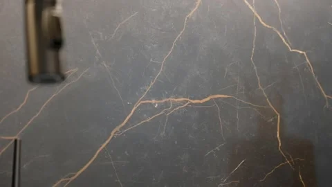 Close up of patterned splashback from black marble in contemporary kitchen Stock Footage 249491970