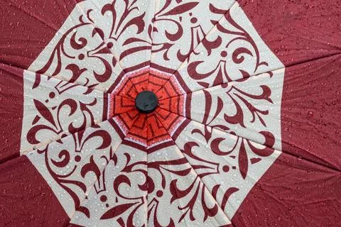 Close-up of a patterned umbrella with water droplets after rain Stock Photos