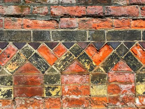 Close up of patterns on ancient wall, Norwich, Norfolk, East Anglia Stock Photos