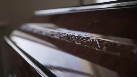 Close-up patterns on the lid of the coffin. Farewell to the deceased in the Stock Footage 309506109