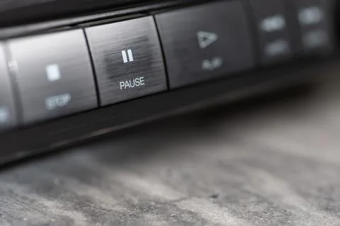Close-Up Of Pause Button On Modern Stereo Panel With Metallic Finish Stock Photos