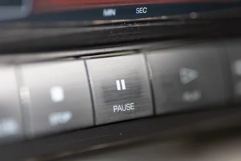 Close-Up Of Pause Button On Modern Stereo Panel With Metallic Finish Stock Photos