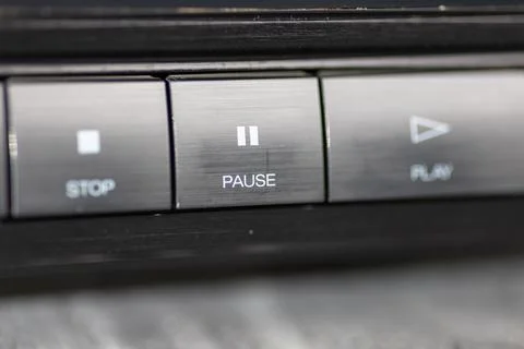 Close-Up Of Pause Button On Modern Stereo Panel With Metallic Finish Stock Photos
