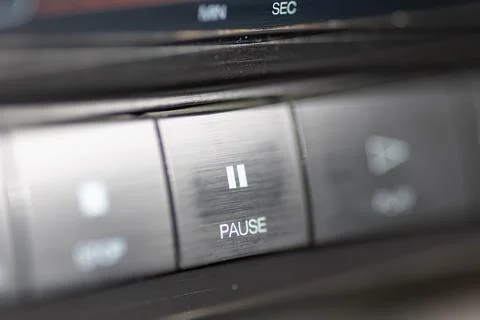 Close-Up Of Pause Button On Modern Stereo Panel With Metallic Finish Stock Photos