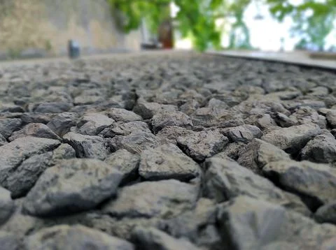 A close-up of a paved path filled with crushed stone, Stock Photos