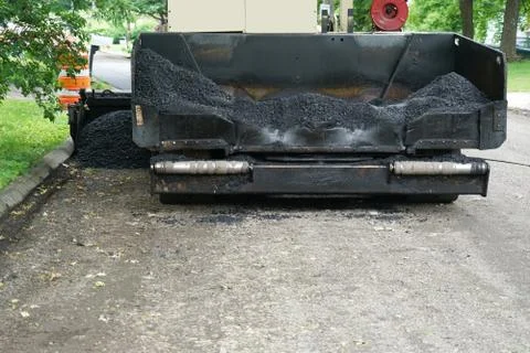 Close up on pavement machine in road construction site Stock Photos