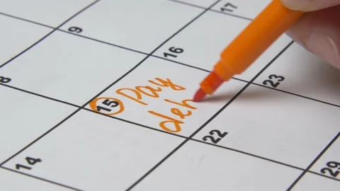 Close up of pay debt word on calendar. Stock Footage 143195553