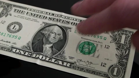 Close-Up Of Payment Of 1 Dollar Video stock 171805309