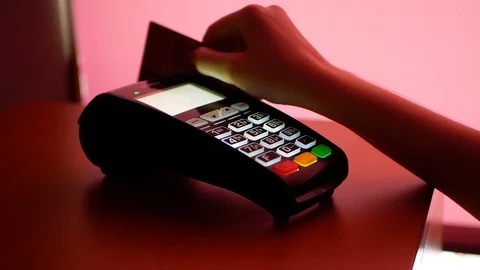 Close up of payment terminal on wooden surface and hands of girl with card Video stock 99093071