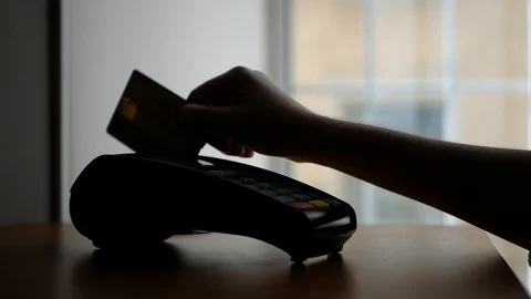 Close up of payment terminal on wooden surface and hands of girl with card Stock Footage 99093111