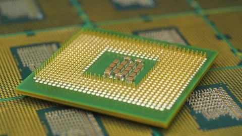 Close-up of a PC CPU with intricate golden pins for fast computing 動画素材 344697922