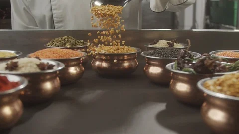 Close-up of pea grains falling on table. Slow motion video Stock Footage 124723817