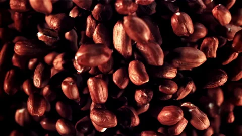 Close up of peanuts on black background, forming a pattern Stock Footage 271327049
