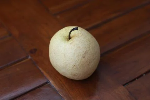 A close up of pear isolated natural pattern wood background. healthy food c.. Stock Photos