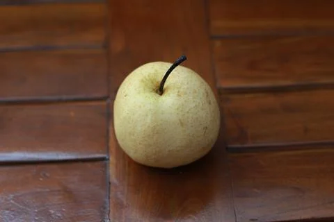 A close up of pear isolated natural pattern wood background. healthy food c.. Stock Photos