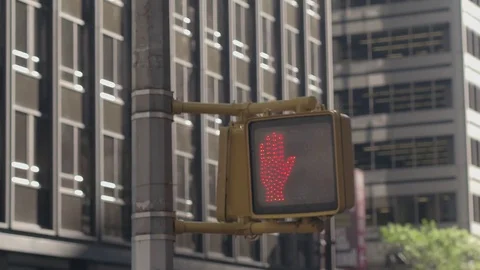 CLOSE UP: Pedestrian crossing light turning from red hand to walking man sign Stock Footage 71786106
