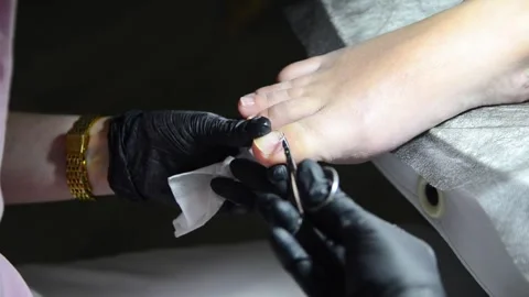 Close-up pedicure with cuticle scissors Видео 342497763