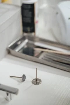 A close-up of a pedicure process with professional manicure tools Stock Photos