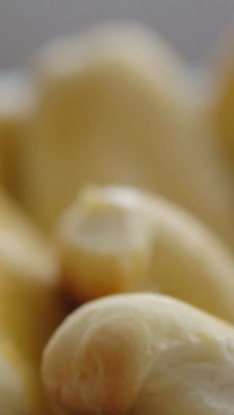 Close up of peeled blanched almonds rotating in a bowl for a healthy snack Stock-Footage 341678685