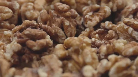 Close up of peeled walnuts with smooth rotation motion Stock Footage 285298480