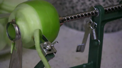 Close up Peeling Apple with Auto Peeler Core Remover Stock Footage 33601297