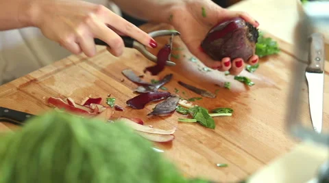 Close-up of peeling beetroot with peeler Stock Footage 59541578