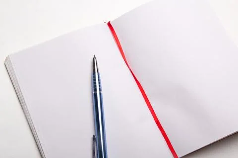 Close up of pen on blank note book Stock Photos