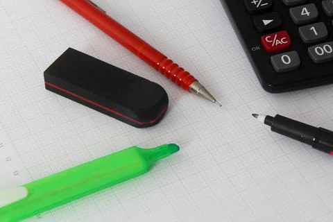 Close up of pen on calculator , notepad on white background Stock Photos
