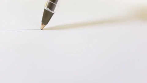 Close-up pen drawing a blue line on a white piece of paper. Abstract Writing and Video stock 144504086
