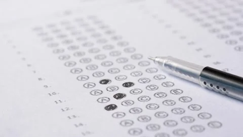 Close up of pen filling bubbles on a multiple choice test answer sheet, edu.. Stock Footage 332623664