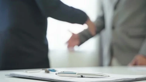 Close up pen put on the desk on the two businessman hands shake background. Stock-Footage 149804865