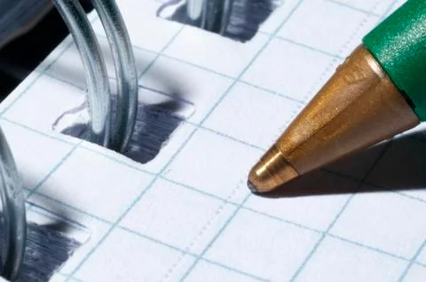 Close up pen vs block notes Stock Photos